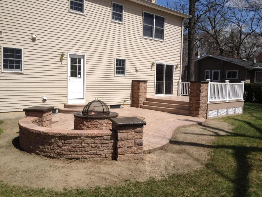 new brown composite deck fire pit stamped concrete