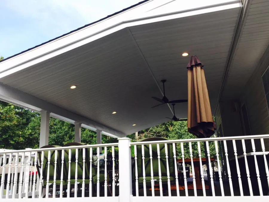 new composite deck tan decking white lattice covered porch concrete pool deck lighting fan3