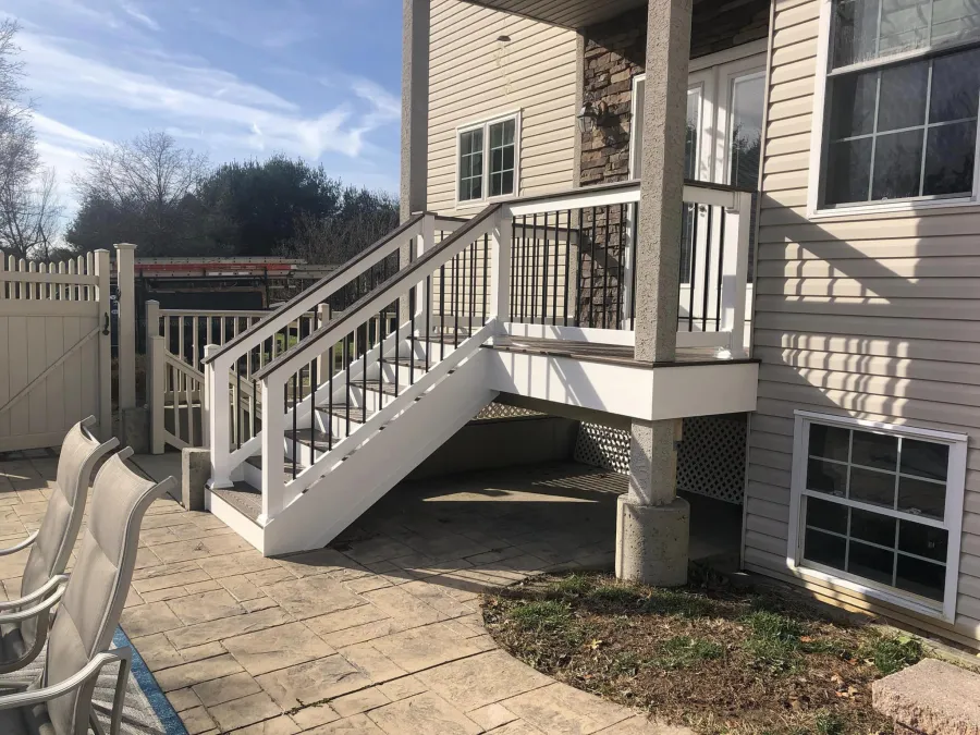 new small back deck and stairs stamped concrete patio2
