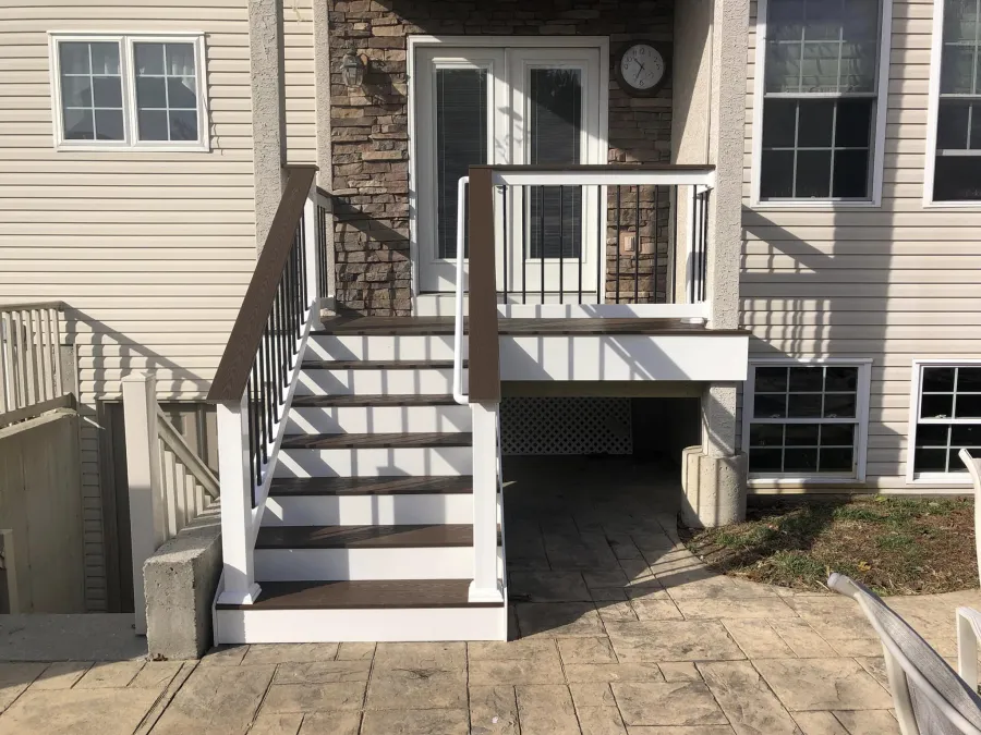 new small back deck and stairs stamped concrete patio4