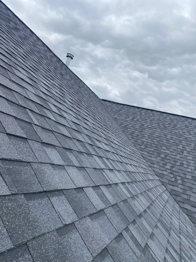 new roof replacement gray shingles gray sky