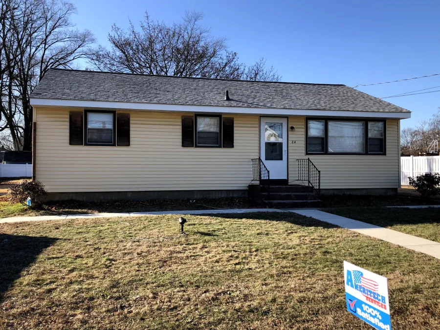 new roof replacement single story tan house with brown shutters