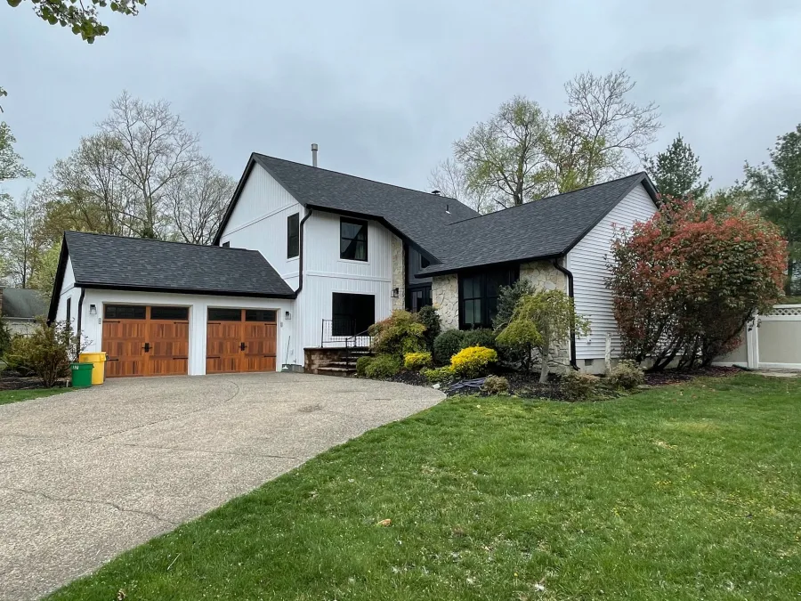 new white verticle siding black windows