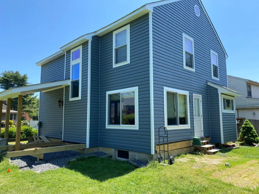 new replacement windows new vinyl siding framed covered patio after