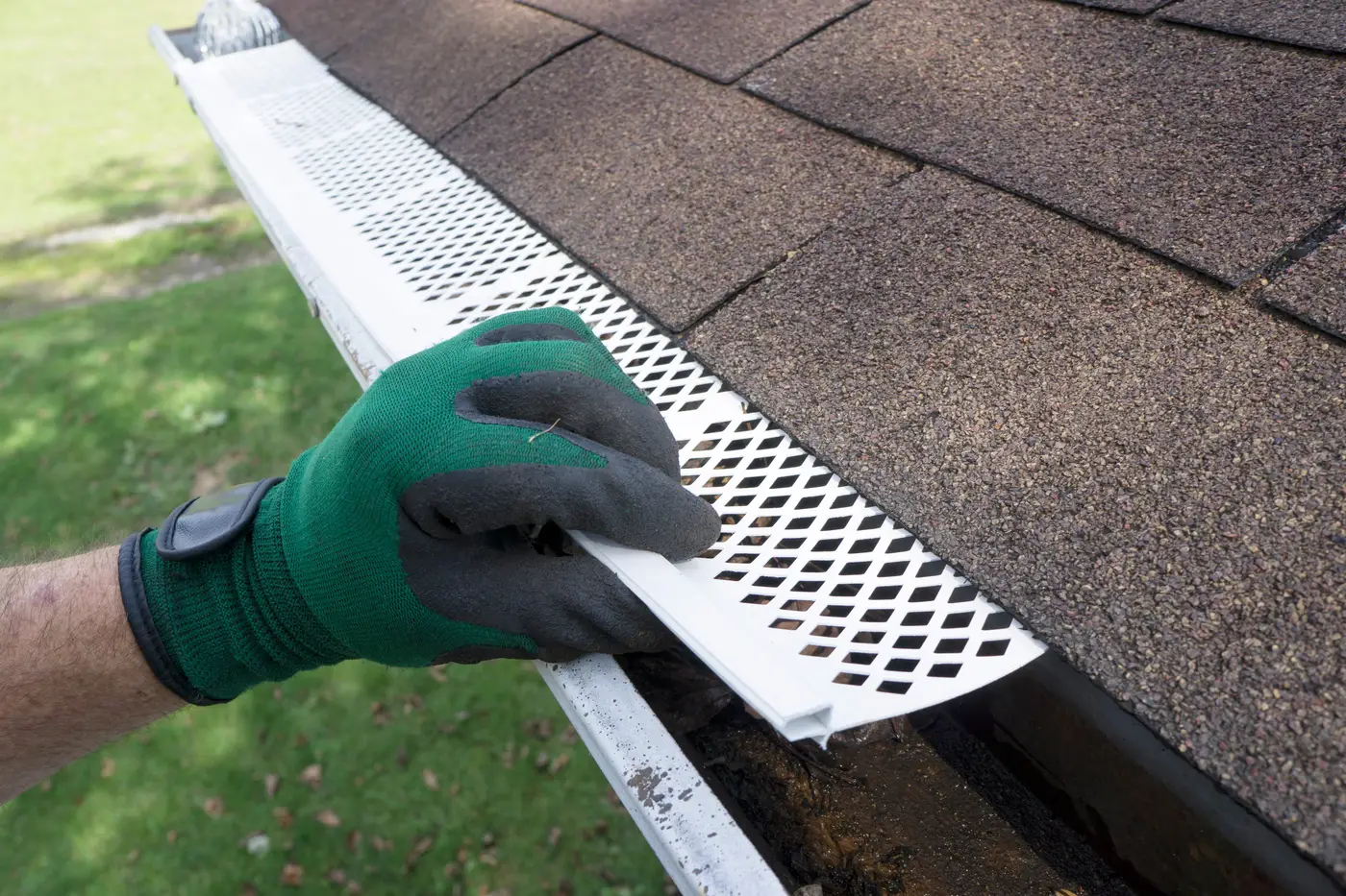 A Contractor Performing Professional Gutter And Gutter Guard Installation On A Home With Ameritech Services Of Southampton, NJ