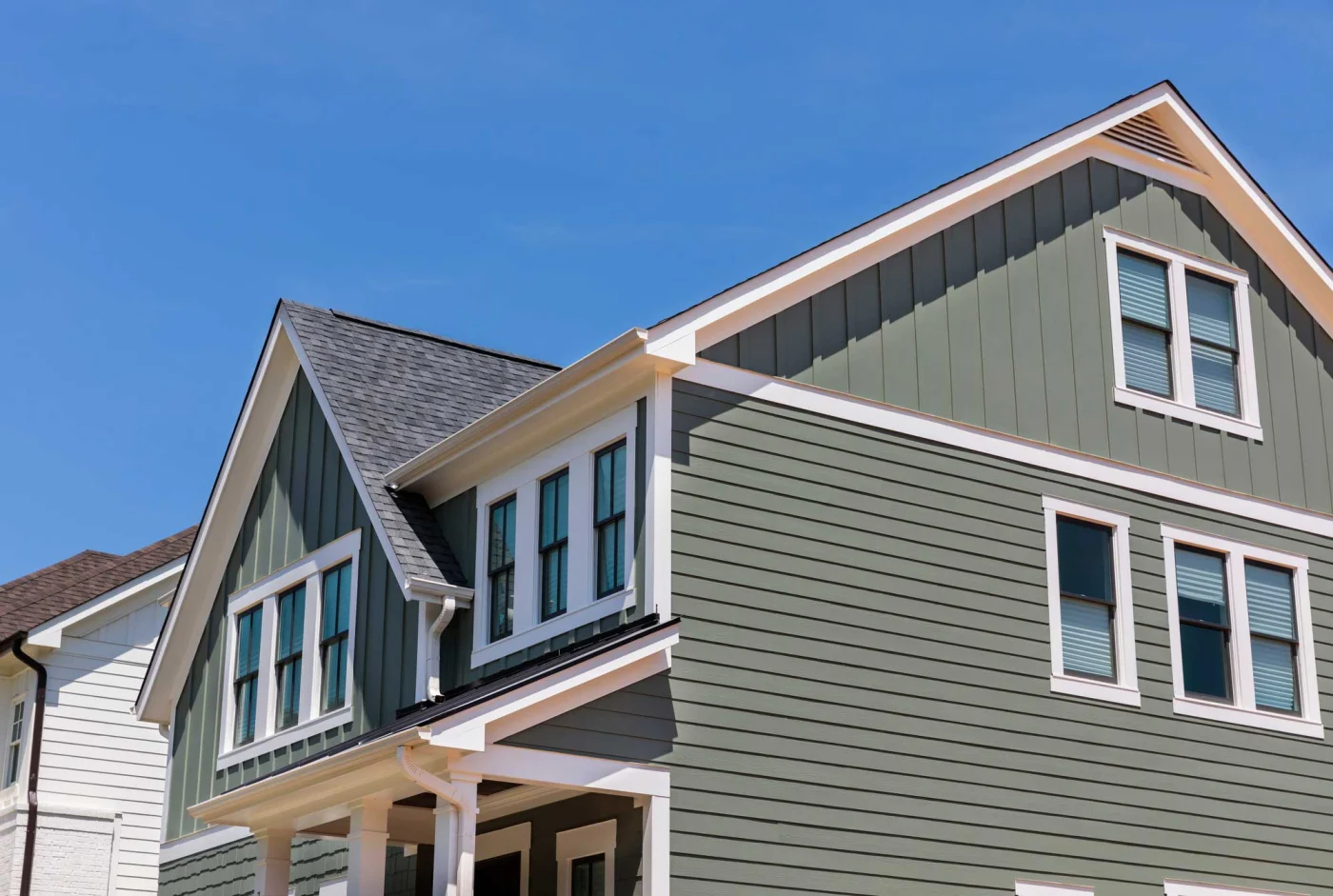 Pale blue siding on a house with a view from a corner outside in Marlton, NJ, by Ameritech Services.