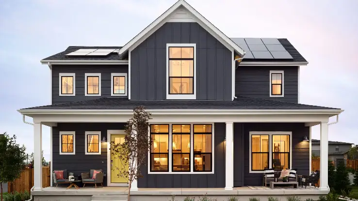 A house with dark gray vertical siding in Sicklerville, NJ by Ameritech Services