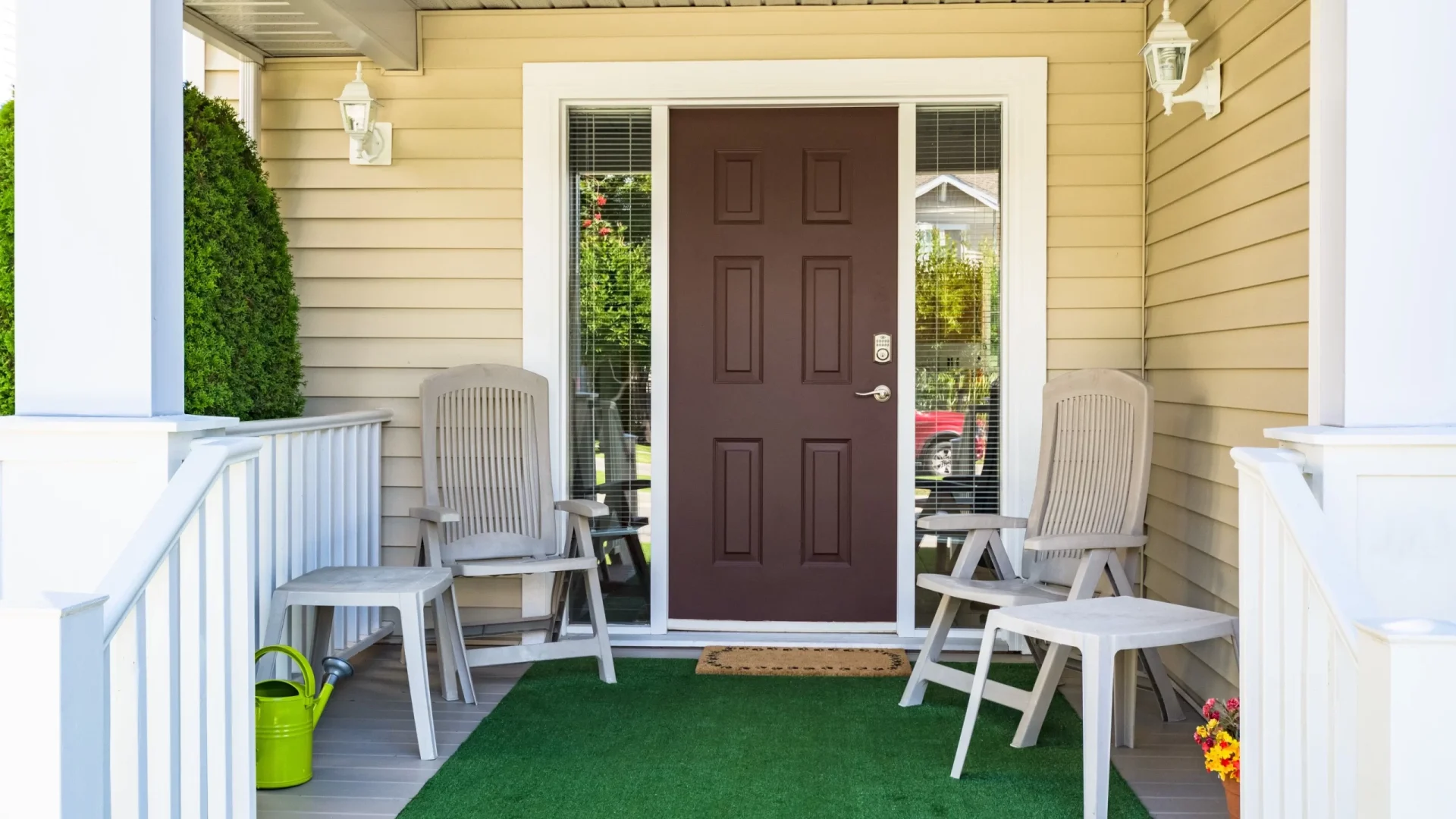 A closeup of the front porch of a house with a brown front entry door in Sicklerville, NJ, by Ameritech Services