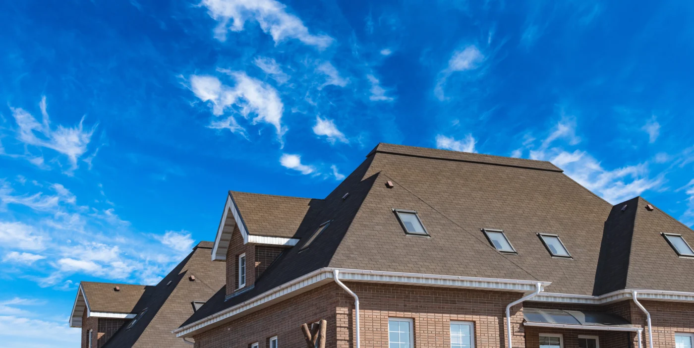 A newly installed roof on a gray home