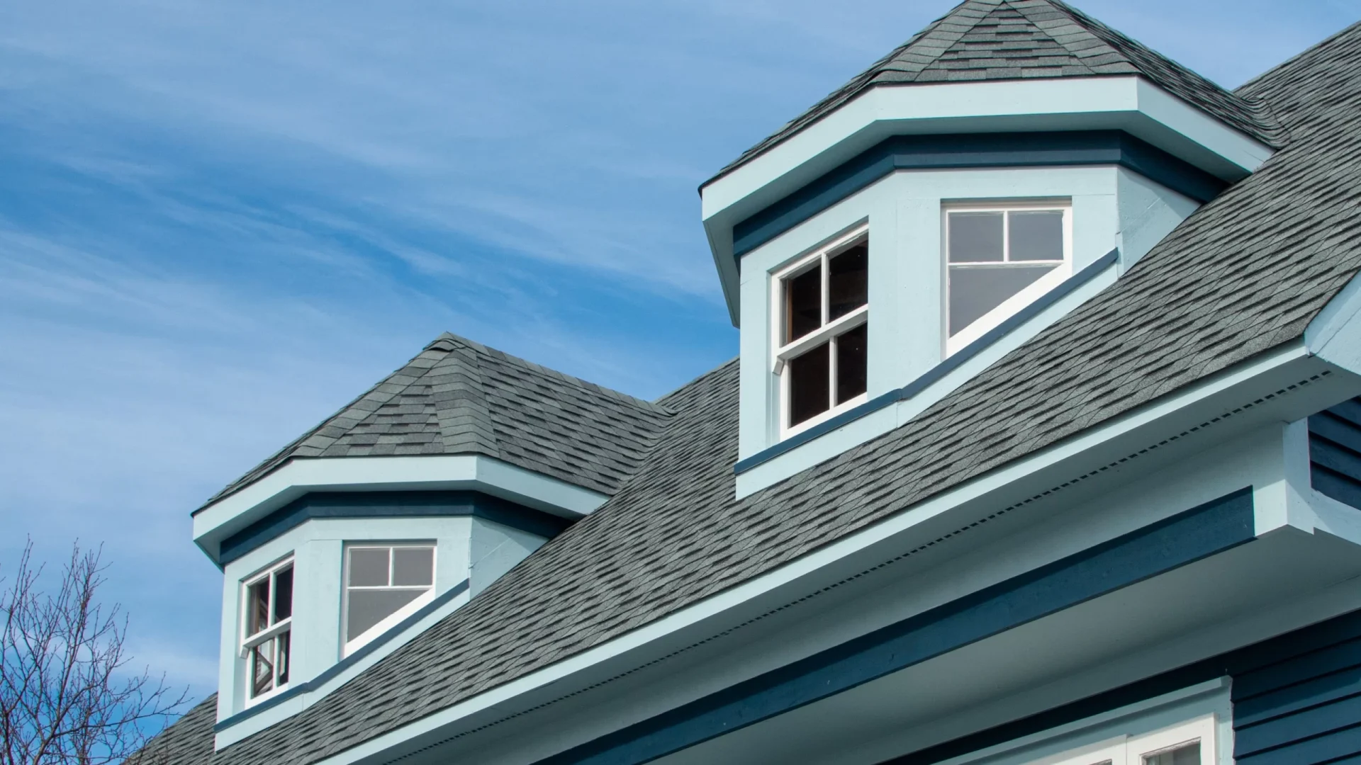 A house with dark gray vertical siding in Sicklerville, NJ by Ameritech Services