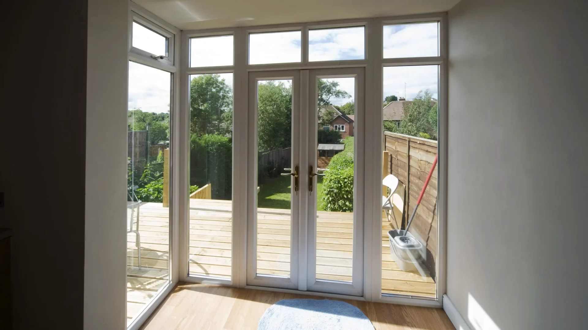 Patio doors of a home with full-length windows on each side in Marlton, NJ, by Ameritech Services.