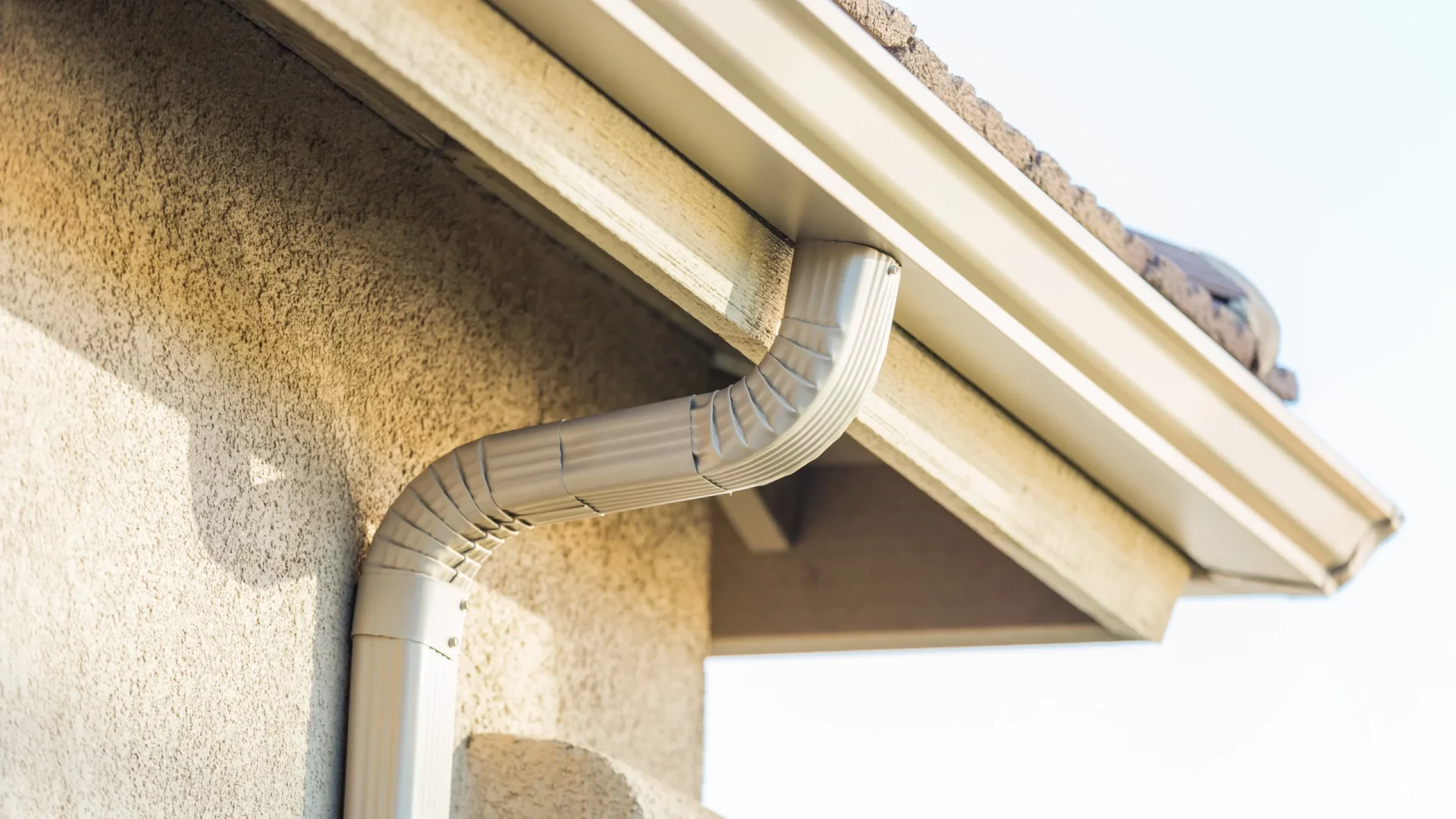 A closeup of a white downspout in Sicklerville, NJ, by Ameritech Services