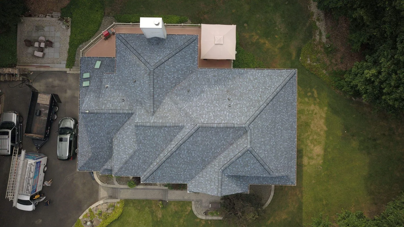 Overhead shot of a newly installed gray asphalt shingle roof