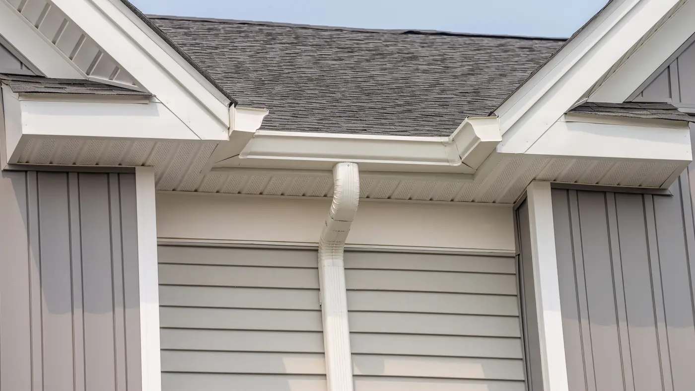 A closeup of a white downspout in Swedesboro, NJ, by Ameritech Services.
