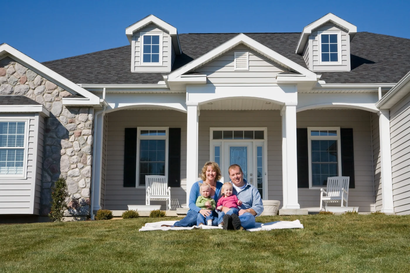 South Jersey family in front of their home after Ameritech installed a new CertainTeed roof. 
